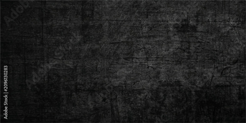 Abstract black background, distressed grunge surface, scratched worn metal surface, with fine surface texture, suitable for branding, wallpaper and header.