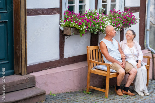 Photos happy senior couple resting wooden bench, Taking time together historic European