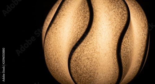 Abstract Golden Sphere with Black Stripes and Textured Surface.