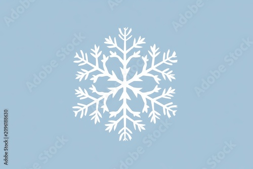 Snowflake resting centered on a pastel blue background in a sharp focus minimalist composition for winter holiday marketing