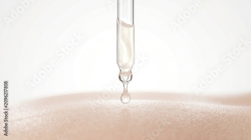 Macro shot of cosmetic pipette dropping essence liquid onto flawless smooth human skin.