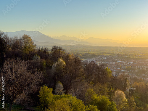 Panoramic view from the Belvedere Gardens in the historic center of Mondovì at sunset.