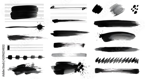 A collection of 18 black and gray brushstrokes and artistic marks on a white background