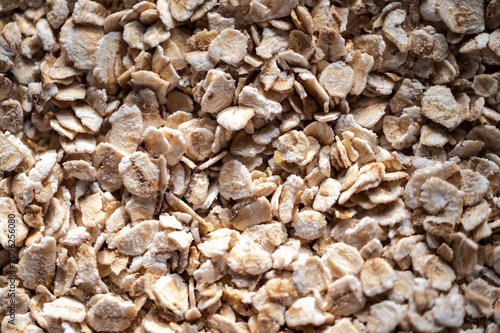 фотографія Full frame background texture of organic rolled oat flakes