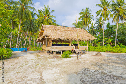фотографія The beach scene with gazebo on the beach under palm tree