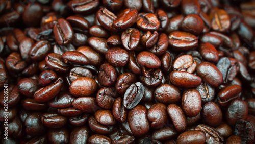 Roasted Coffee Beans on a Vibrant Red Background