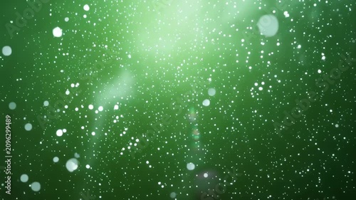 Green background with white particles and sparkles shining brightly