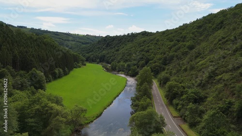 Aerial View of Scenic River Valley and Country Road