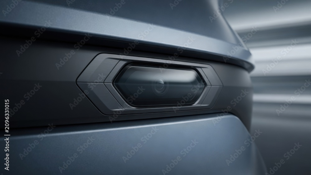 Obraz premium Modern Car Headlight Close-Up with Motion Blur Background