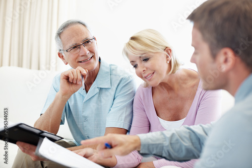 фотографія Document, elderly couple or smile with financial advisor in house, investment planning or pension annuity