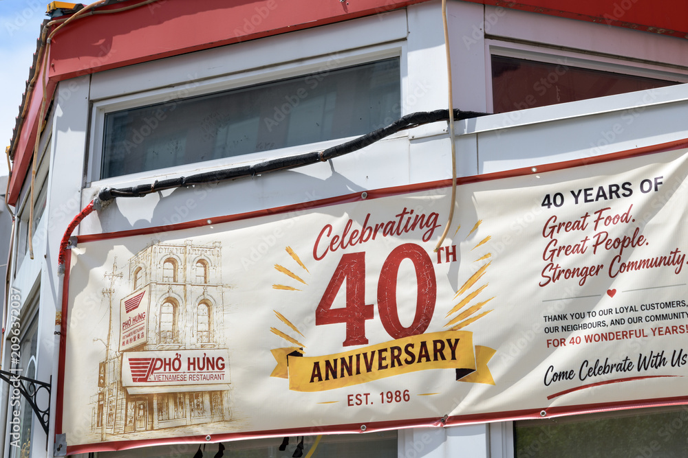 Obraz premium 40th Anniversary banner outside Phở Hưng Restaurant, a Vietnamese restaurant, located at 350 Spadina Av, Toronto