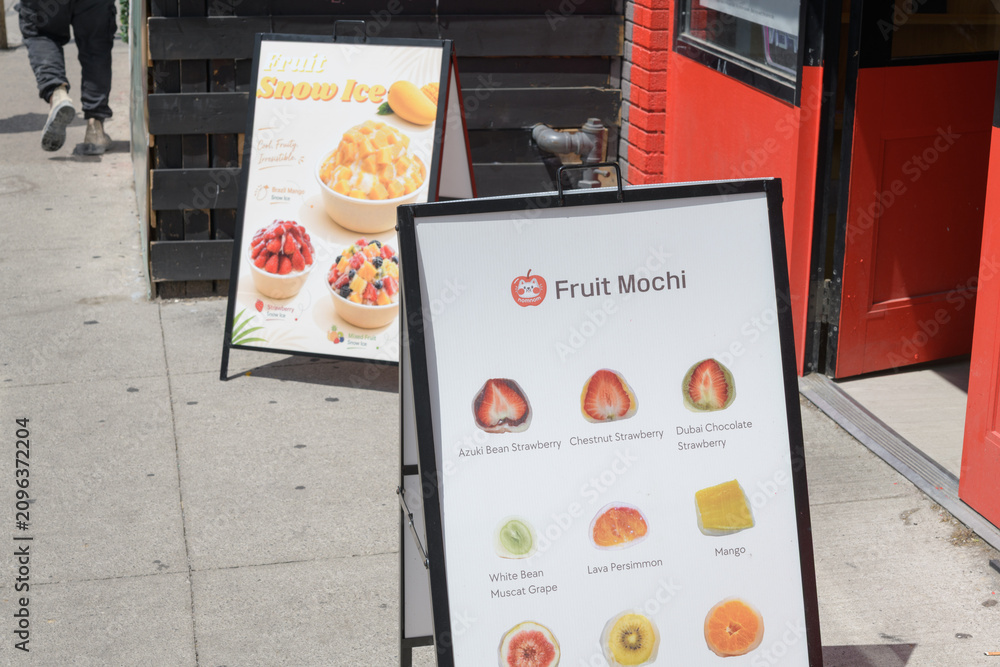 Obraz premium fruit mochi a-frame sidewalk signs in Kensington Market, Toronto