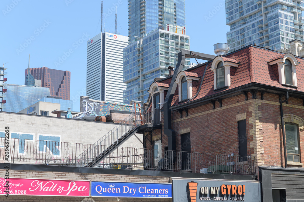 Obraz premium exterior building and signs of Ye Perfect Nails & Spa (159 John St), directly beside Queen Dry Cleaners (157 John St) and next to Oh My Gyro (155 John St), Toronto