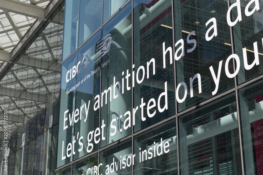 Obraz premium vinyl sign on the glass curtain wall of CIBC Square building at 81 Bay St, Toronto