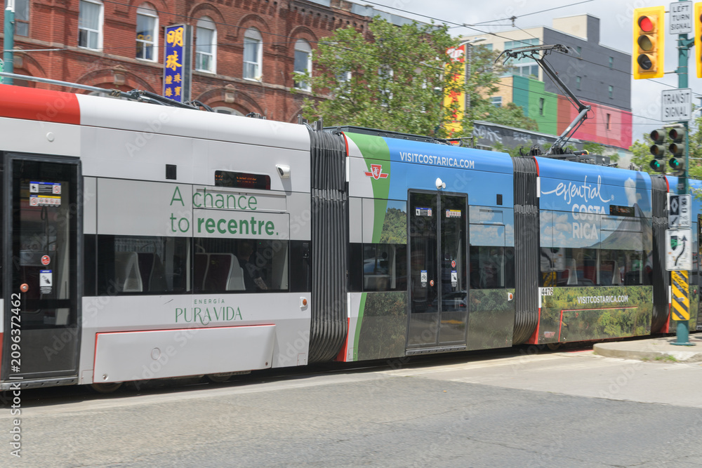 Obraz premium streetcar wrap travel advertisement for Costa Rica, Toronto