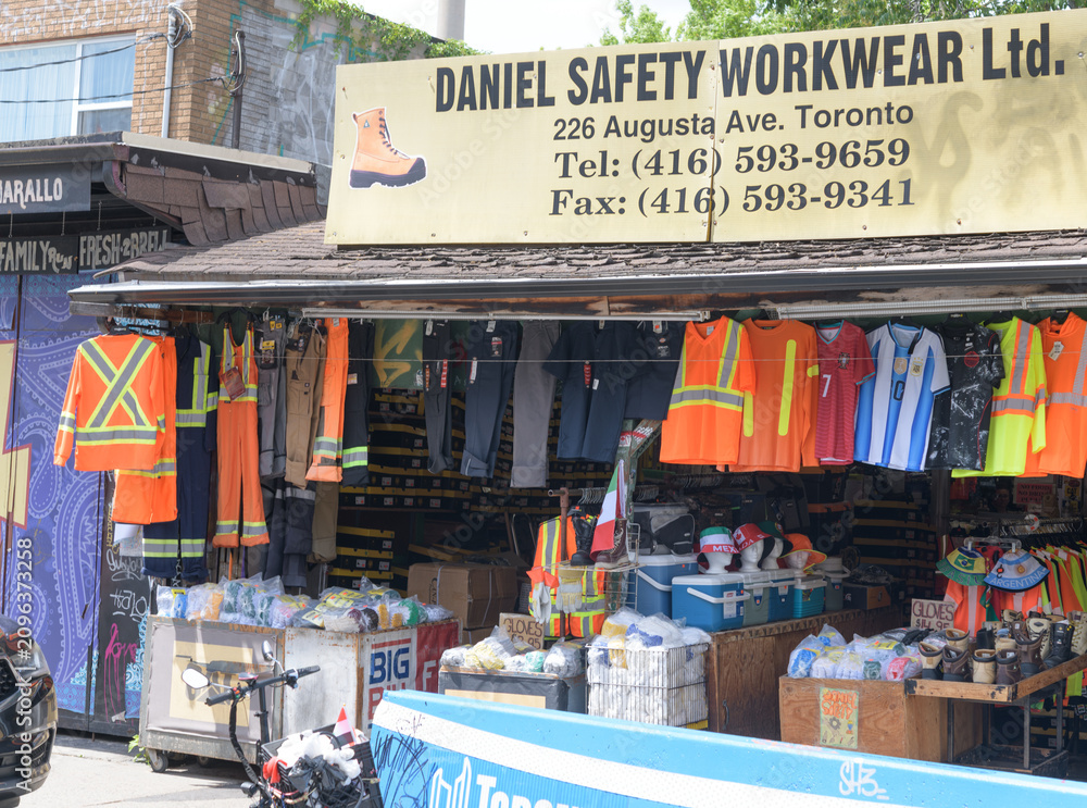 Obraz premium exterior building and sign of Daniel Safety Workwear, a safety equipment supplier, located at 226 Augusta Av, Kensington Market, Toronto