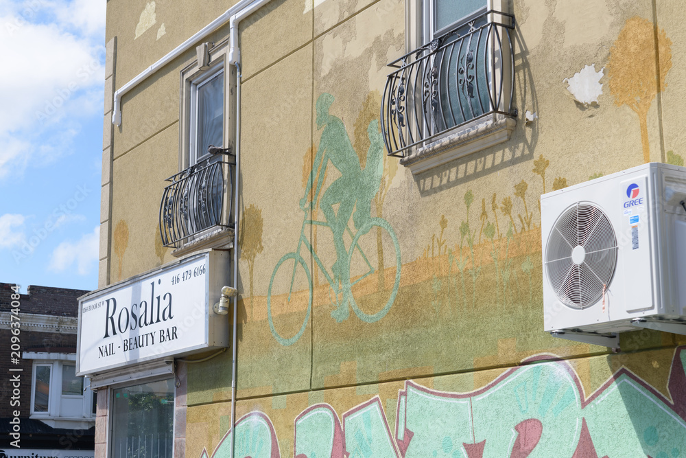 Obraz premium mural on the east side of a commercial property at 1264 Bloor St W, location of Rosalia Nail & Beauty Bar, Toronto