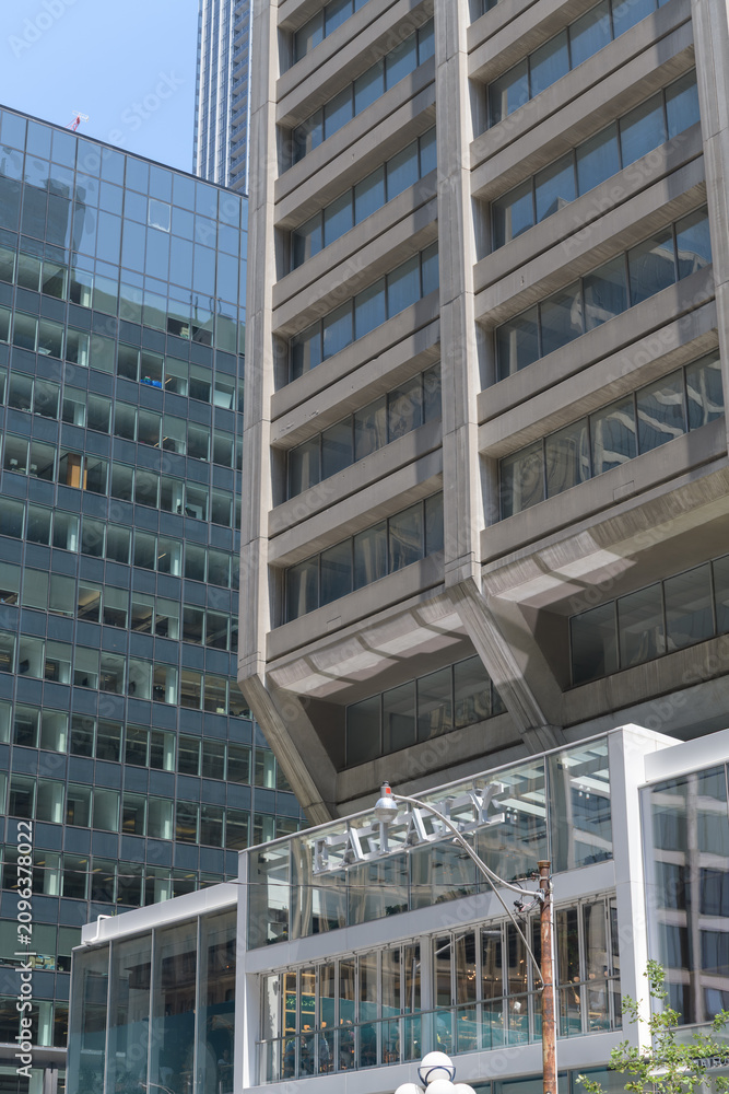 Obraz premium exterior building facade corner detail and sign of Eataly, an Italian restaurant and gourmet grocery store, located at 55 Bloor St W inside Manulife Centre, Toronto