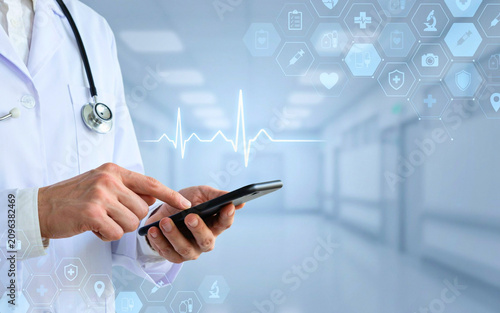 Medical Professional Using Mobile Device with Holographic Heart Rate Monitor and Healthcare Technology Interface