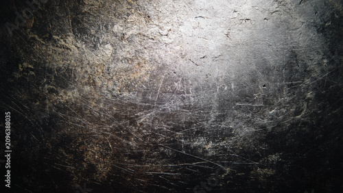 Cuadro en lienzo Scratched and weathered metal surface with rough texture and faded marks