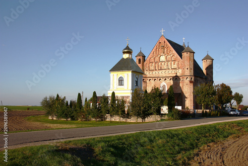 Synkovichi, Grodno region, Belarus. The operating temple - historical value. Farmer fields around.
