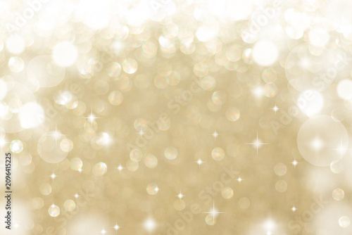 Soft gold bokeh background with sparkling light and festive glitter effect for celebration