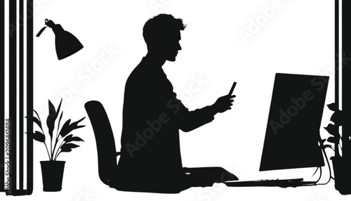 Man sitting at a desk uses a smartphone while working at a computer monitor within an office environment that includes a lamp and a potted plant to symbolize contemporary multitasking habits.