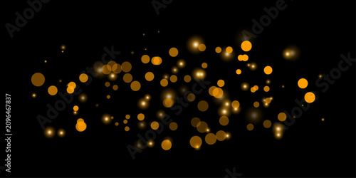 Golden bokeh lights on black background elegant sparkle effect for festive designs and dramatic visuals