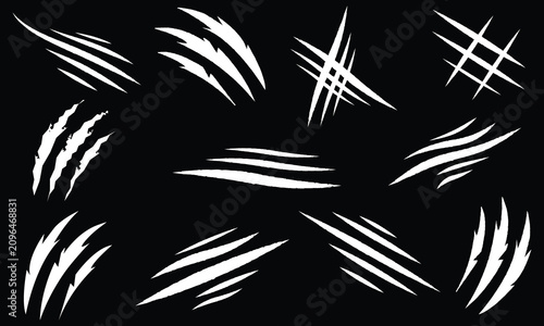 Foto Set of white animal claw scratch marks and sharp slashes on black background