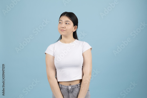 Young woman standing straight posing confidently looking forward