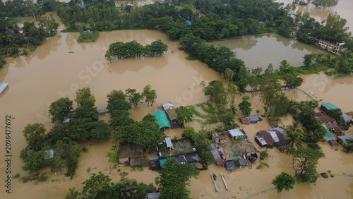 Canvastavla This aerial photograph captures the devastating impact of flooding in Bangladesh, where rising floodwaters have submerged roads, homes, and surrounding farmland, disrupting daily life