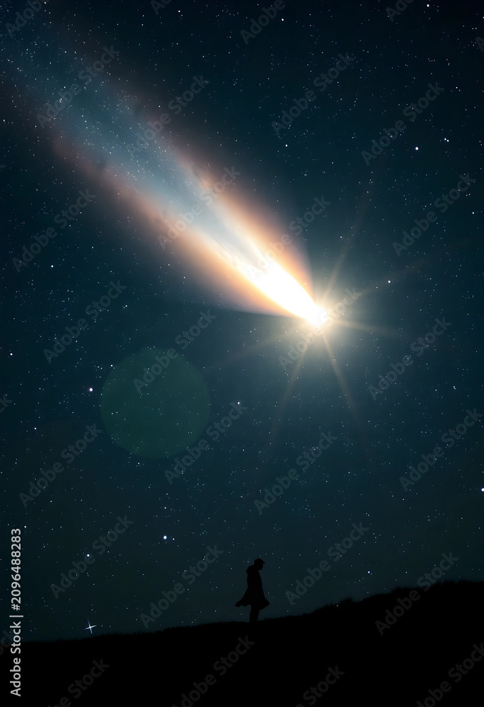 Fototapeta premium Silhouette of person watching bright comet in starry night sky