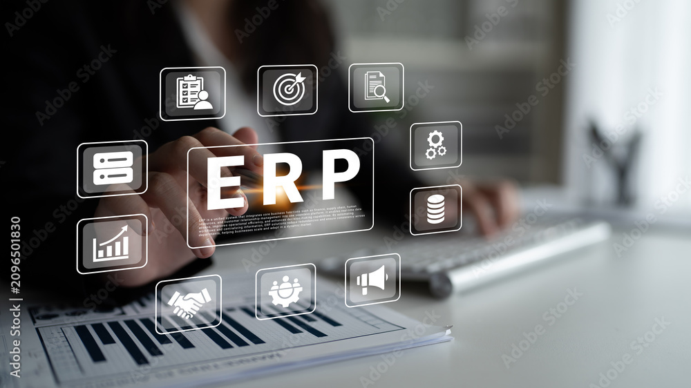 Fototapeta premium Modern workspace showcasing a business professional using ERP software. Digital icons represent key business functions, emphasizing efficiency and productivity in management. Ledger