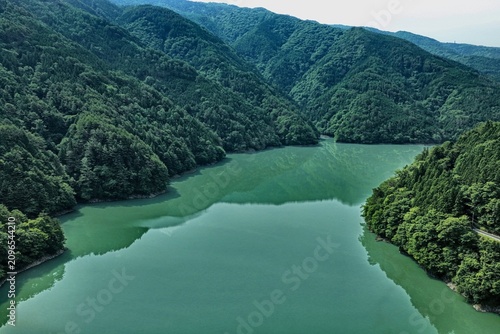 Canvas Print Aerial drone photo of Ikawa Lake surrounded by green mountains in Shizuoka, Japa