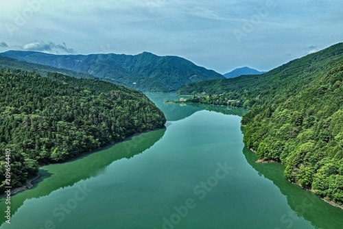 Canvas Print Aerial drone photo of Lake Ikawa surrounded by green mountains in Shizuoka, Japa