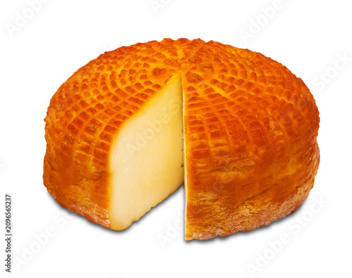 Piece of fresh round homemade smoked cheese on a transparent or white background. Side view. PNG.