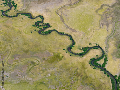 A narrow creek meanders through a wetland in the Deschutes National Forest near Mt. Bachelor, Oregon. Wetland habitats support a wide variety of species.
