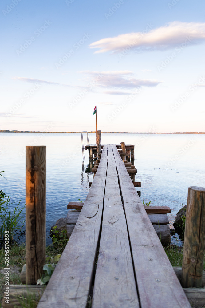 Fototapeta premium wooden pier on a lake serene summer