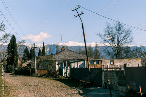 Photography Sukhum, Abkhazia, 22 March 2020, Street with small house and cottage in suburbs