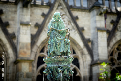 Statue of Hugo Wstinc, the writing canon of the cathedral chapter 