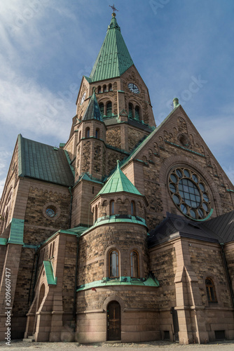 Photography Low angle view of the historic Sofia Church (Sofia kyrka) with green copper spir