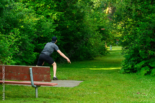 Disc Golfer Watches Drive Down Fairway
