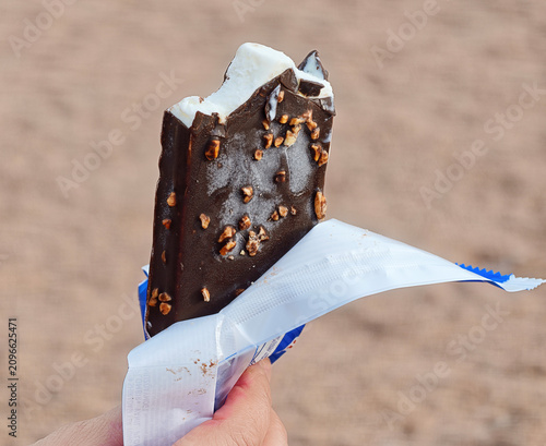 Nogger ice cream bar from Langnese, which features a vanilla filling and a chocolate coating with nuts.