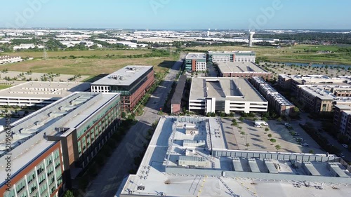 Expansive business campus features multi story office buildings surrounded by structured parking green belts. Infrastructure supports large scale professional workforce needs in Coppell, TX