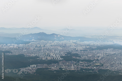 Canvas Print Bukhansan mountain overlook with sprawling Seoul skyline and layered mountain ra