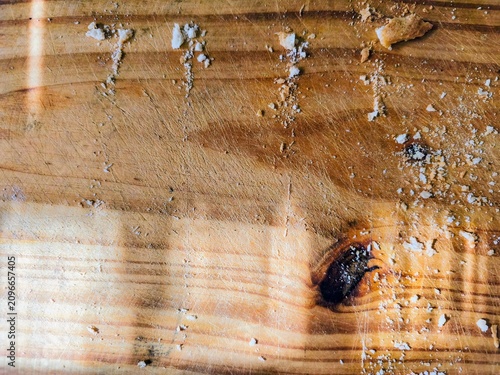 flat lay view of a wooden cutting board with a bunch of breadcrumbs 
