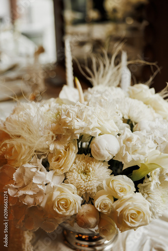 White Wedding Flower Bouquet with Elegant Floral Decor
Luxury White Floral Arrangement for Wedding Reception
Close Up of White Roses and Flowers in Event Decor