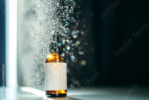 Canvas Print Serum bottle product display with sparkling bokeh