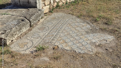 Athens, Greece - 22 June 2026. Early Christian mosaic floor with geometric bands, scallop motifs and heart shaped corner panels at the Basilica of Megali Panagia.