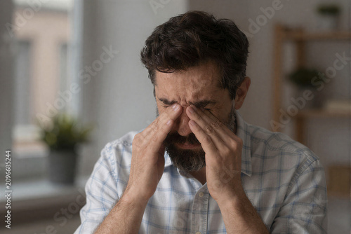 Man Expressing Deep Sorrow Closeup